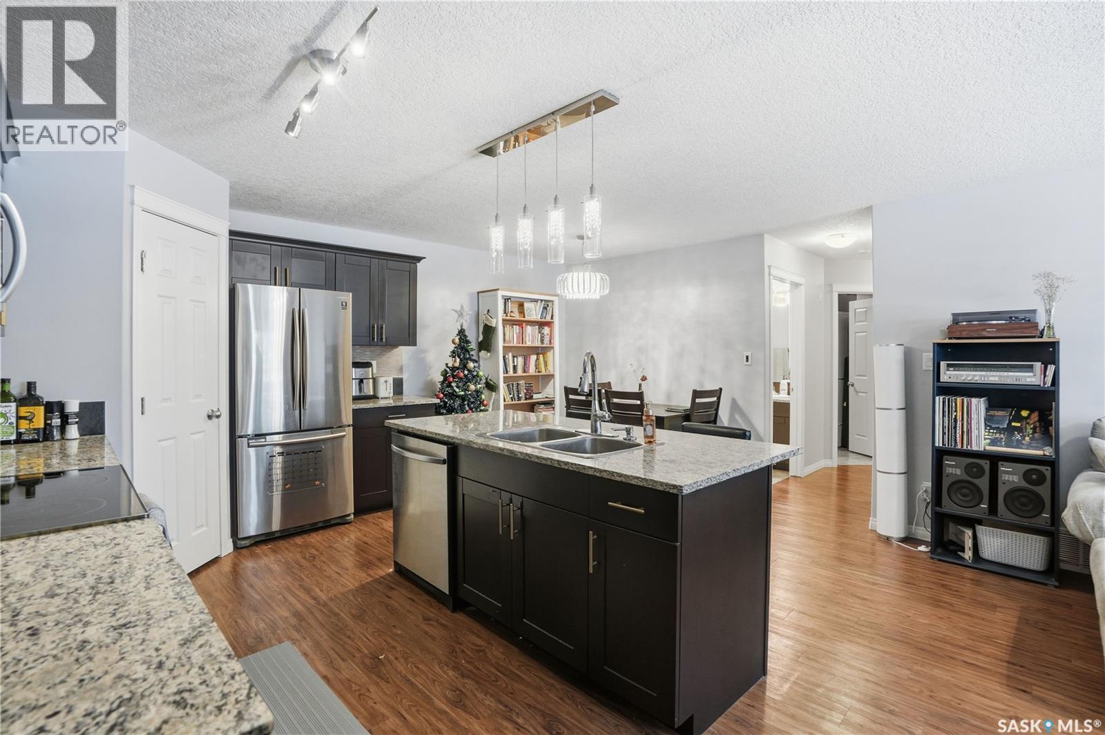 116 125 Willis Crescent, Saskatoon, SK - Indoor Photo Showing Kitchen With Double Sink