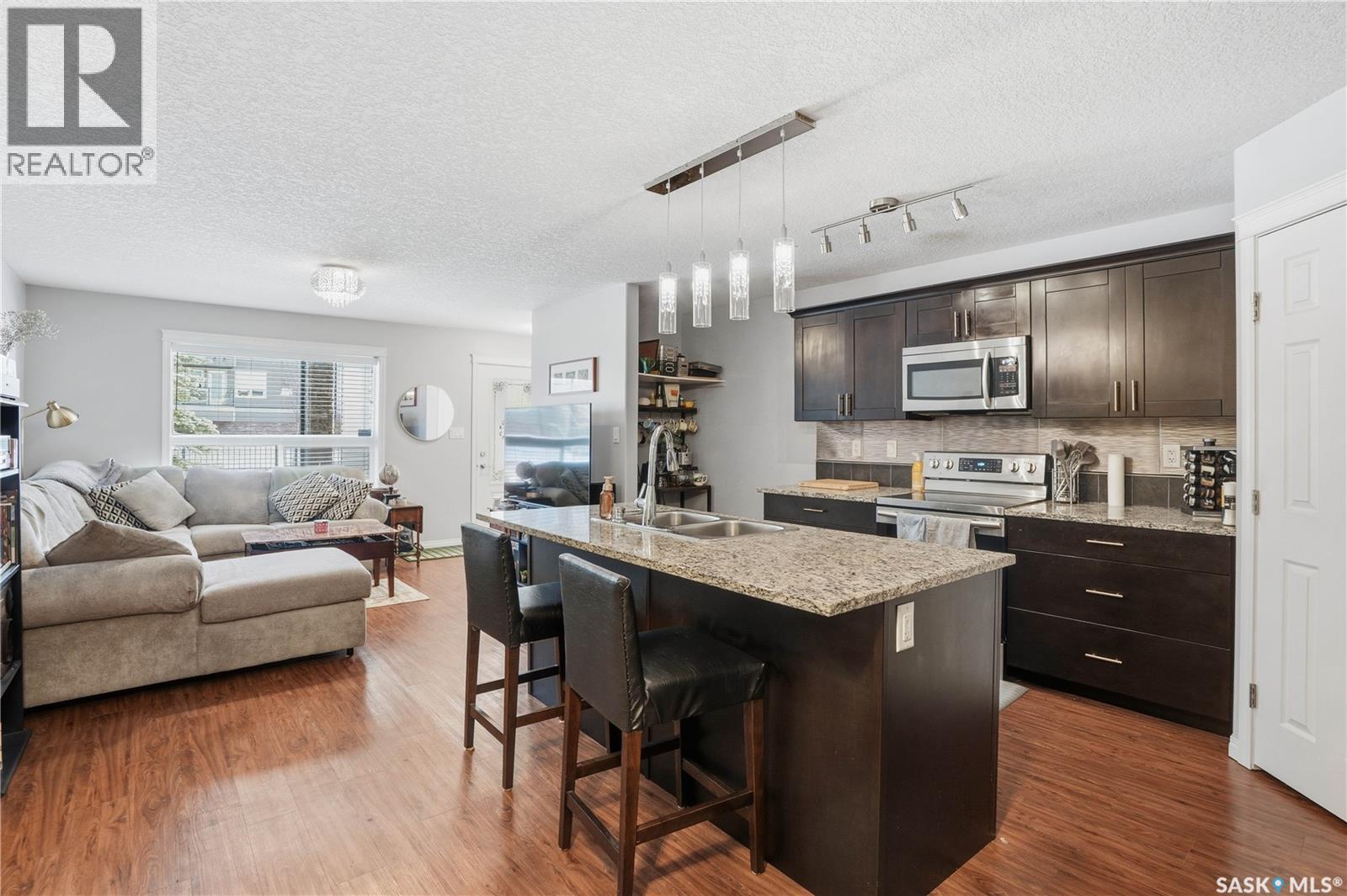 116 125 Willis Crescent, Saskatoon, SK - Indoor Photo Showing Kitchen With Double Sink