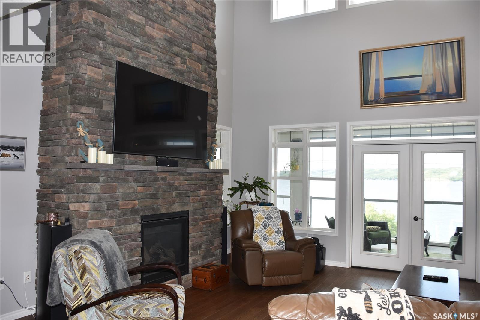50 Aaron Place, North Qu'Appelle Rm No. 187, SK - Indoor Photo Showing Living Room With Fireplace