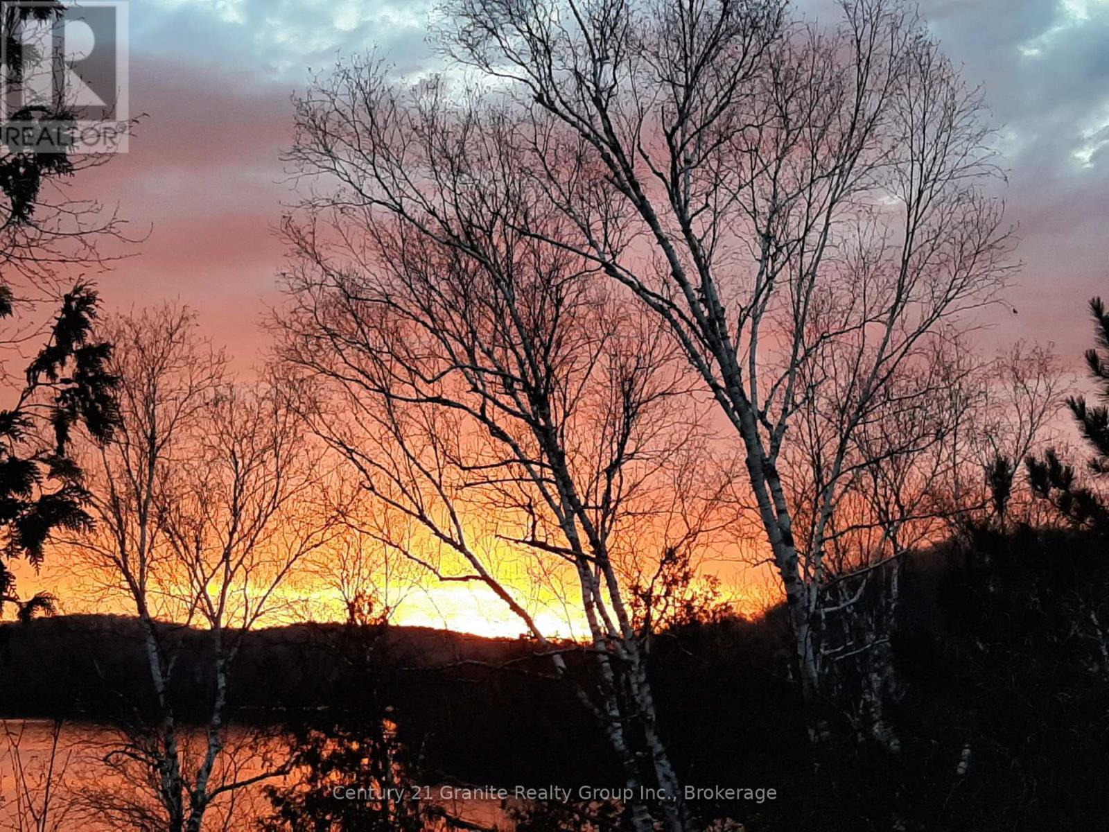 Sunrise from cottage - 1119 Wampum Road, Dysart Et Al (Dudley), ON - Outdoor With View