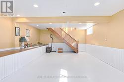 Basement rec room with gas fireplace. -