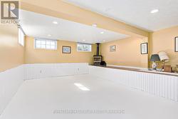 Basement rec room with gas fireplace. -