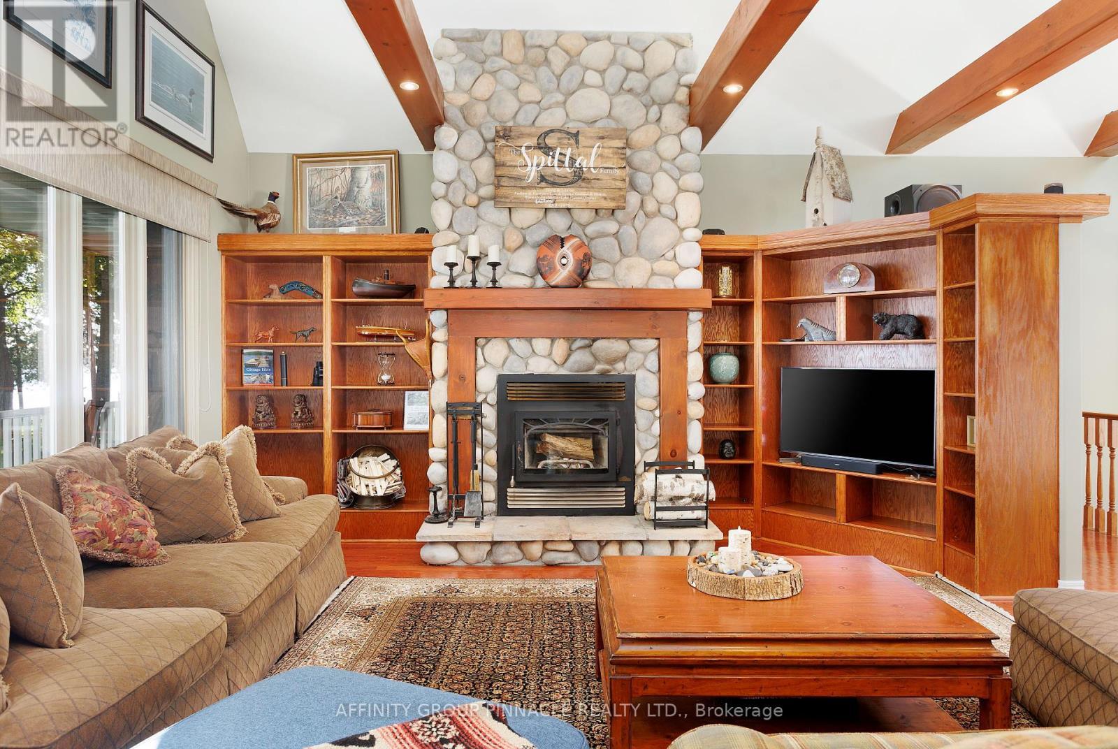 12 Edgewood Drive, Kawartha Lakes (Verulam), ON - Indoor Photo Showing Living Room With Fireplace