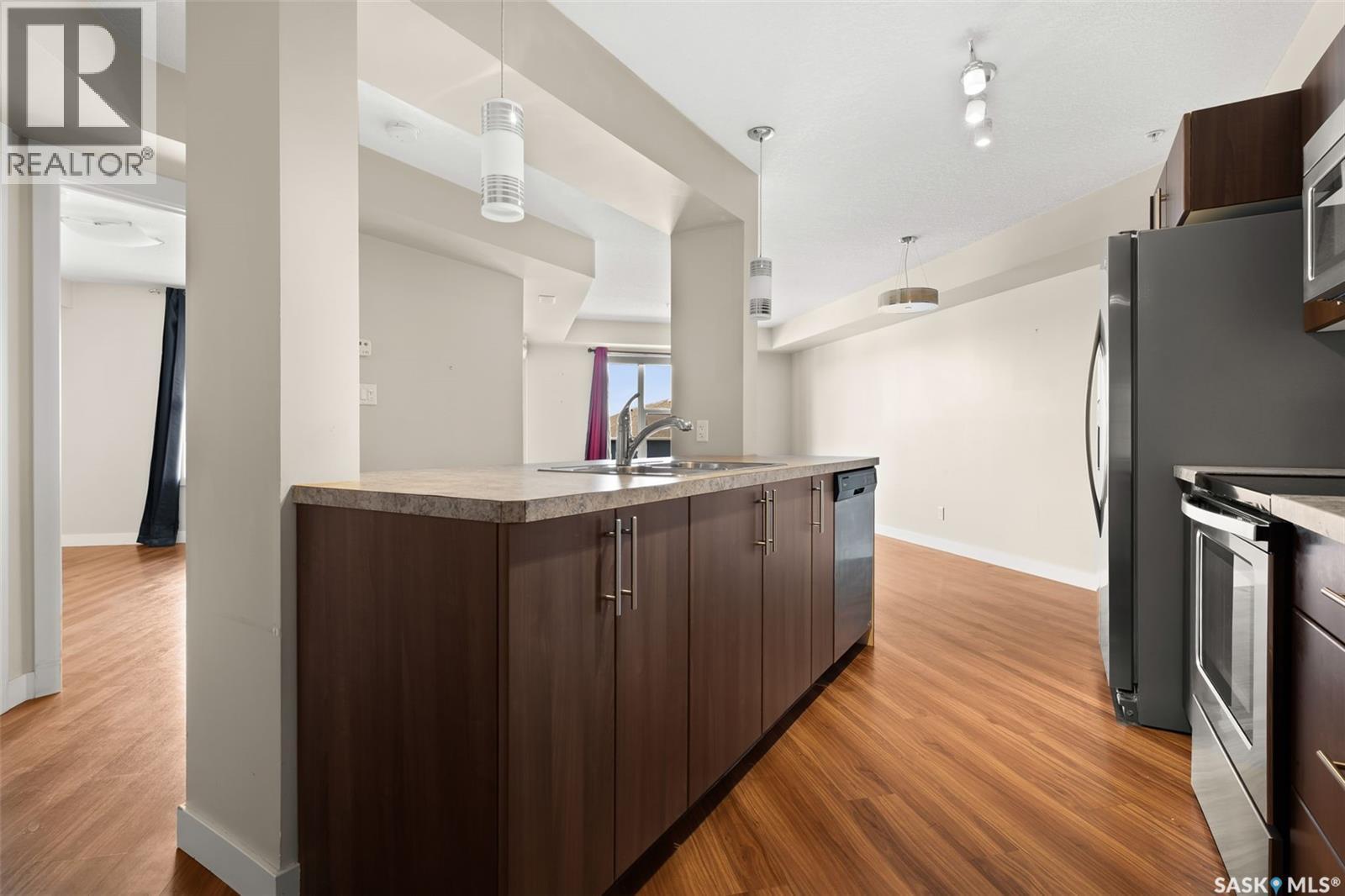 311 5301 Universal Crescent, Regina, SK - Indoor Photo Showing Kitchen With Stainless Steel Kitchen