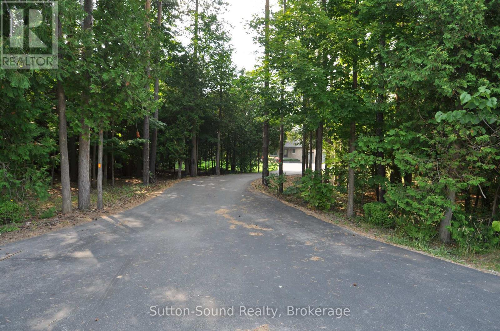 Property from the entrance at the road - 318760 Grey Road 1, Georgian Bluffs, ON - Outdoor
