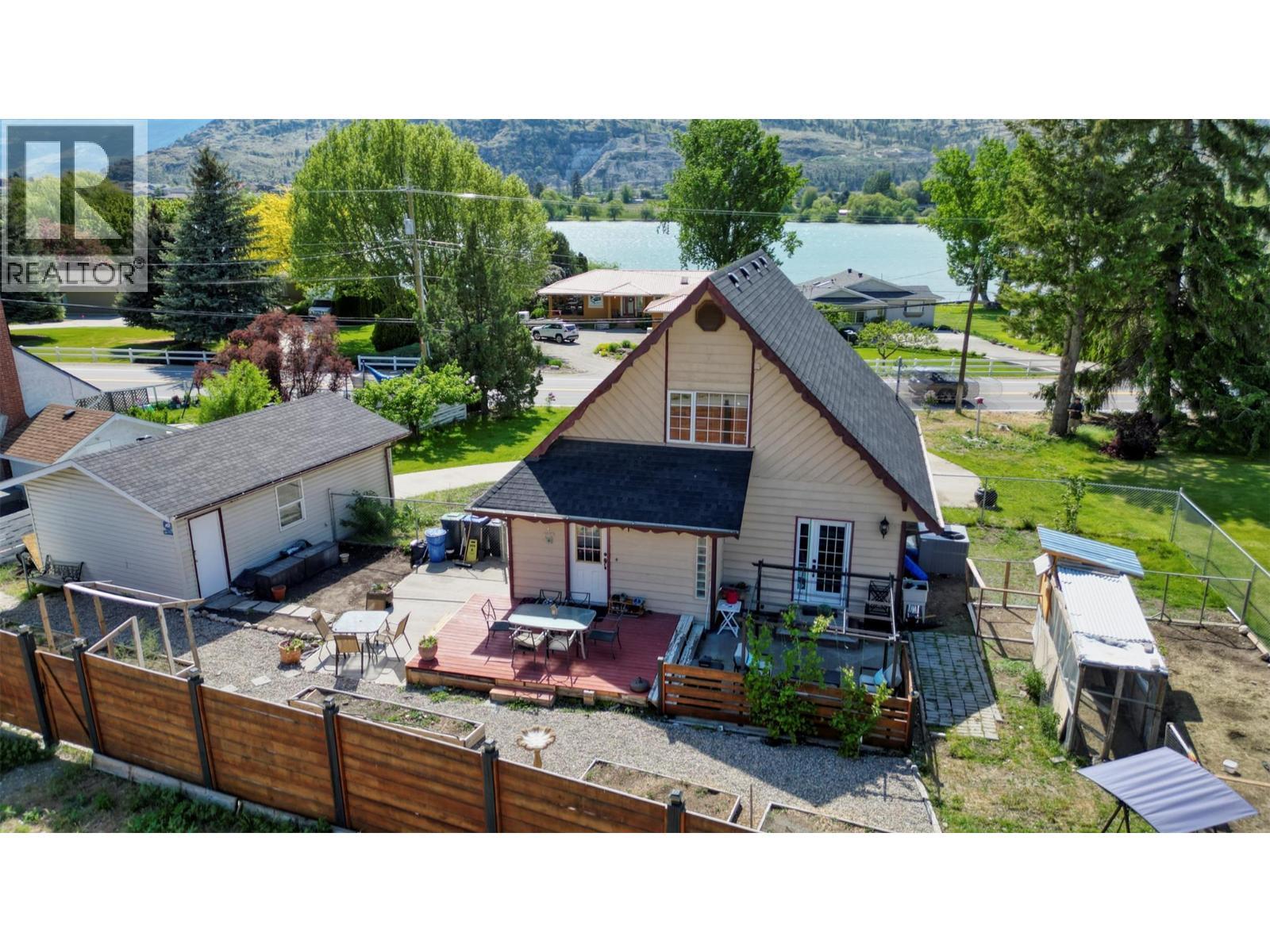 7137 Tucelnuit Drive, Oliver, BC - Outdoor With Body Of Water With Deck Patio Veranda