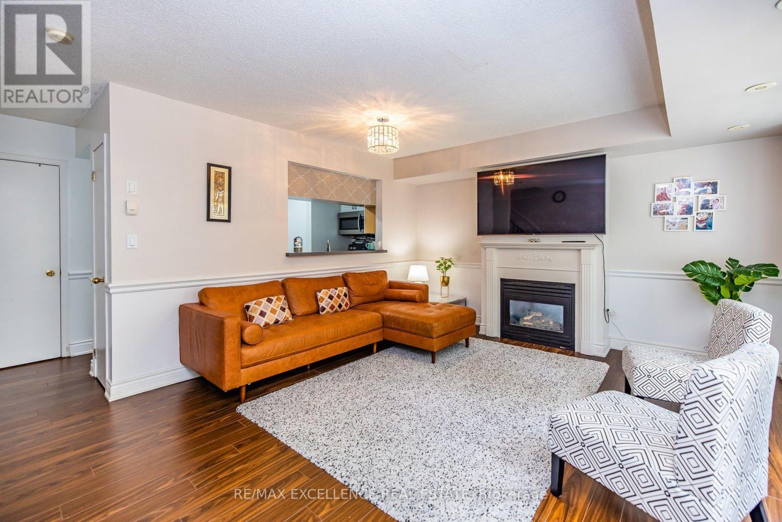 1205 - 5 Everson Drive, Toronto, ON - Indoor Photo Showing Living Room With Fireplace