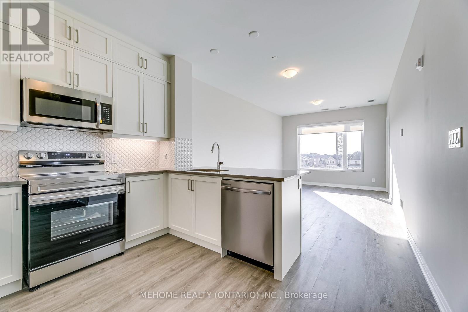 312 - 3265 Carding Mill Trail W, Oakville, ON - Indoor Photo Showing Kitchen With Stainless Steel Kitchen