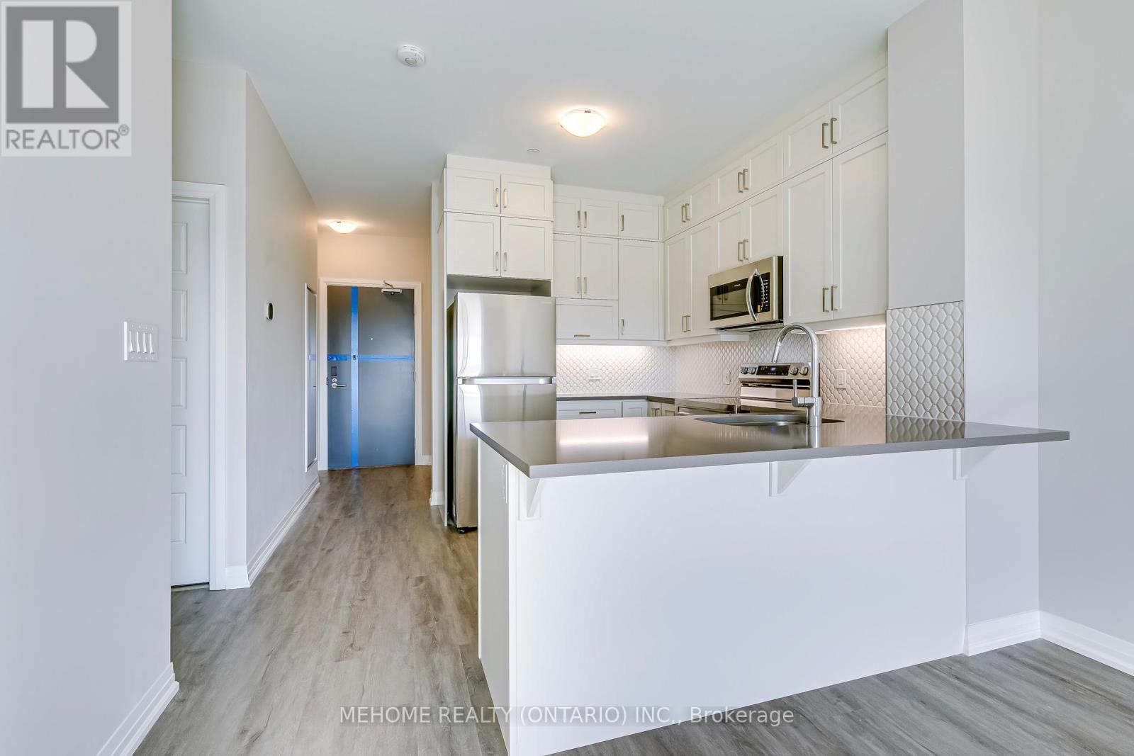 312 - 3265 Carding Mill Trail W, Oakville, ON - Indoor Photo Showing Kitchen With Stainless Steel Kitchen With Upgraded Kitchen