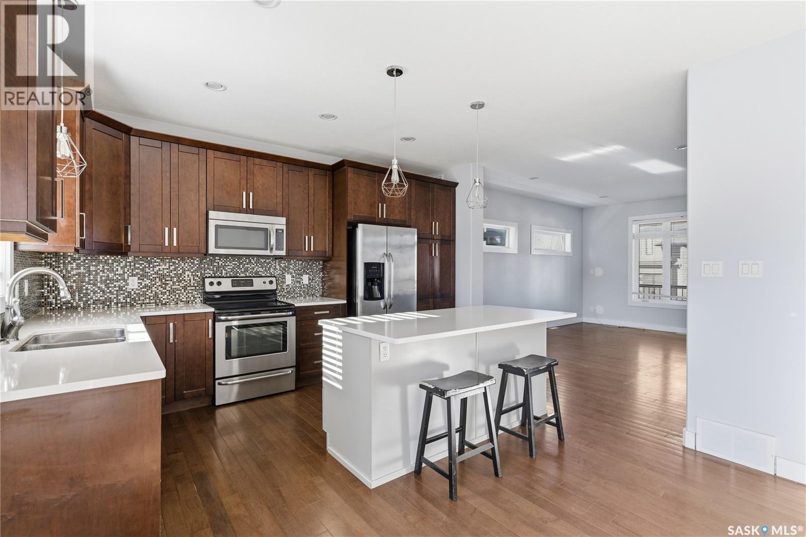 567 Kloppenburg Crescent, Saskatoon, SK - Indoor Photo Showing Kitchen With Stainless Steel Kitchen With Double Sink With Upgraded Kitchen