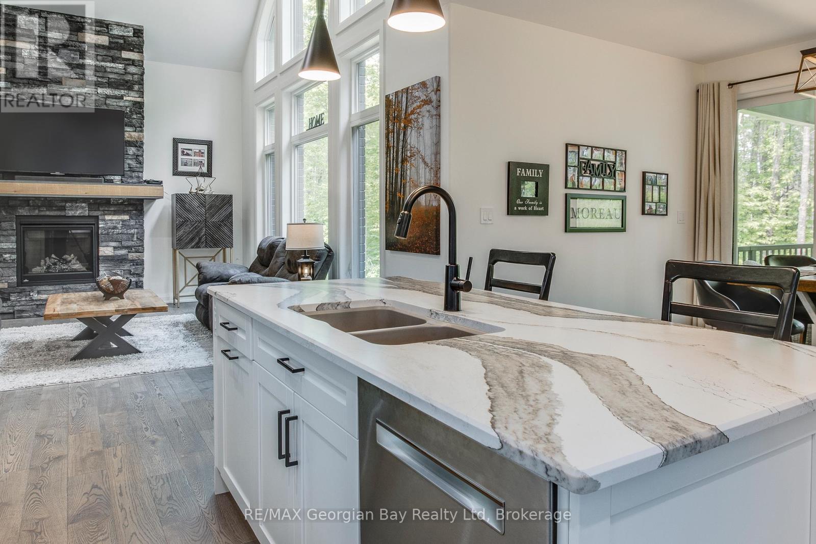 50 Windermere Circle, Tay, ON - Indoor Photo Showing Kitchen With Fireplace With Double Sink