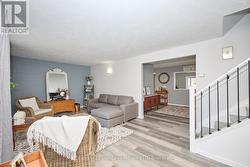 View of the dining room and stairs from the foyer -