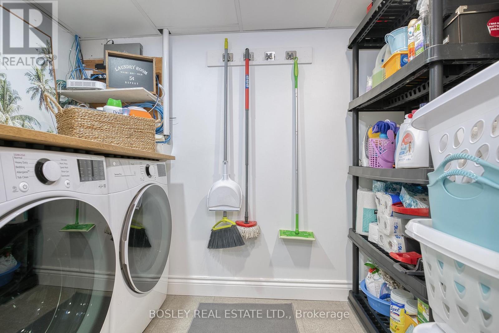 compact laundry area with larger front load W/D - 29 Patika Avenue, Toronto, ON - Indoor Photo Showing Laundry Room