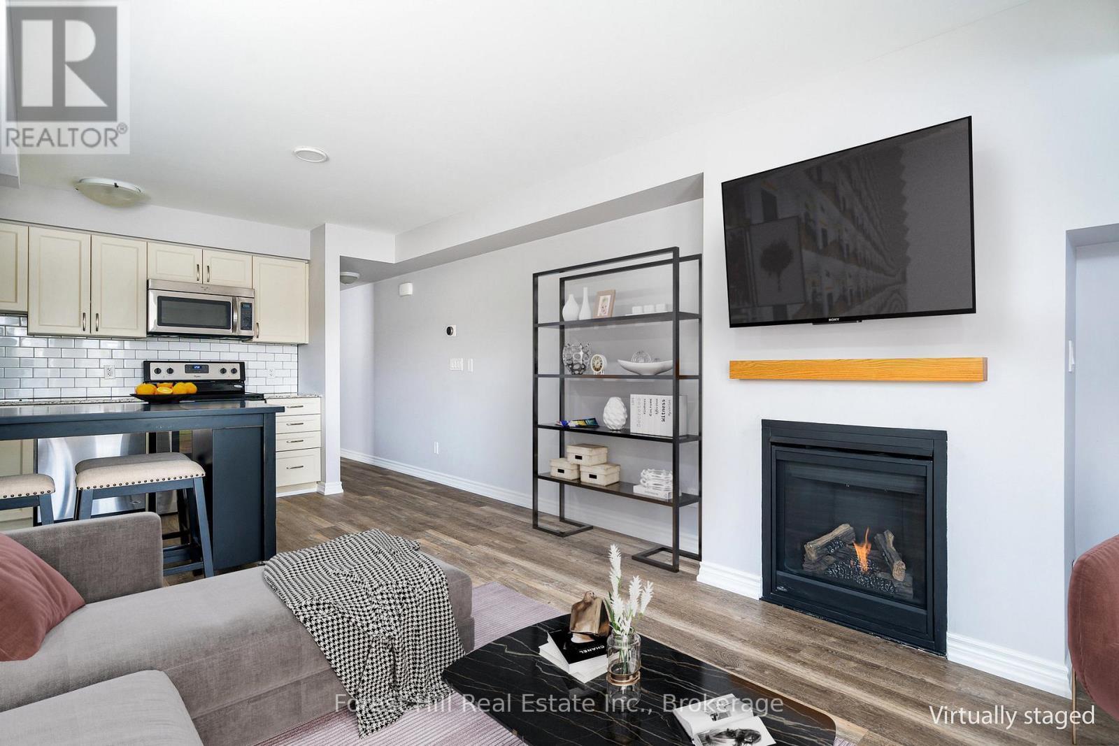 108 - 2 Anchorage Crescent, Collingwood, ON - Indoor Photo Showing Living Room With Fireplace