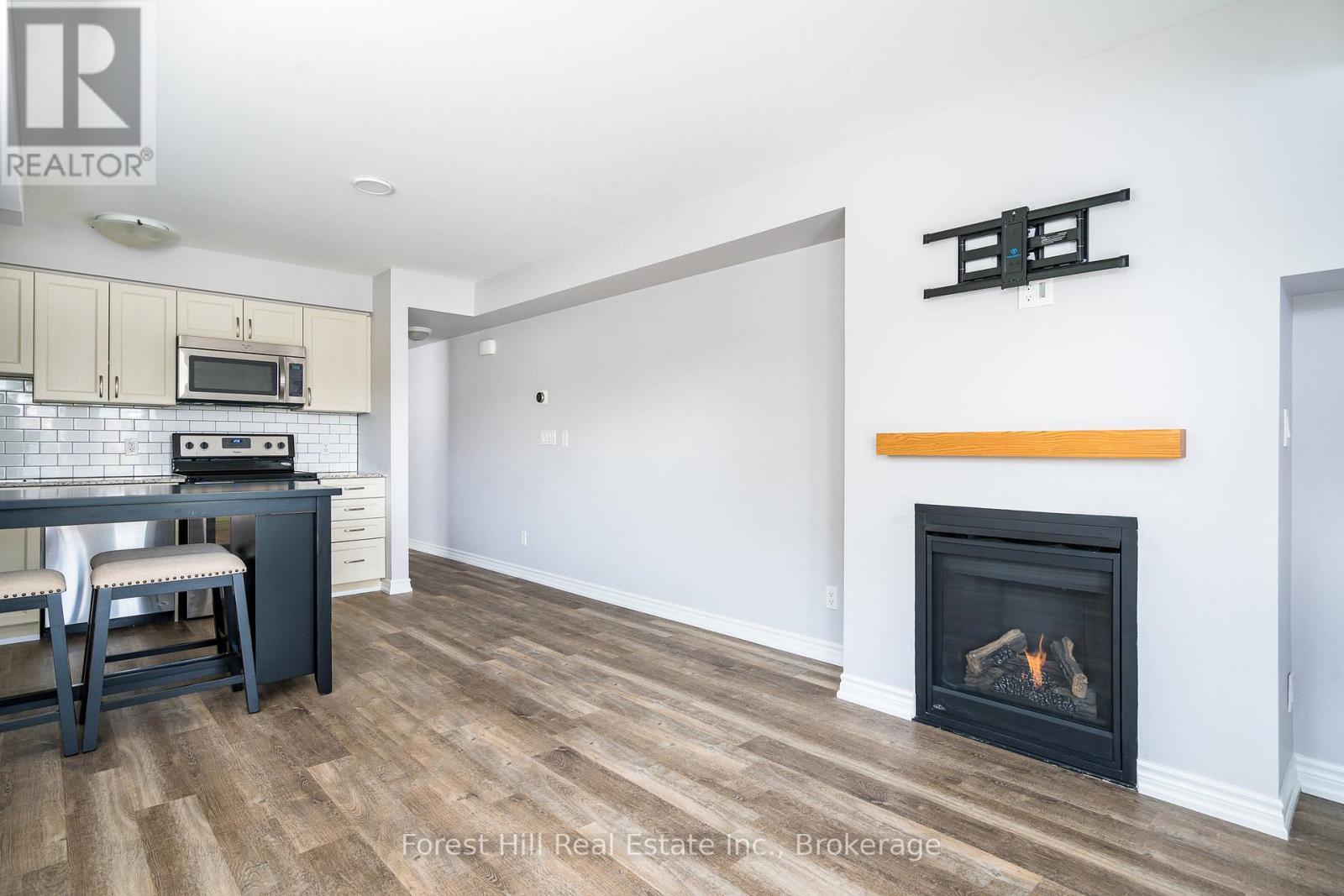 108 - 2 Anchorage Crescent, Collingwood, ON - Indoor With Fireplace