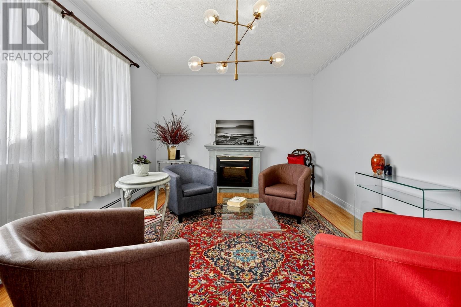 44 Dock Road, Bareneed, NL - Indoor Photo Showing Other Room With Fireplace