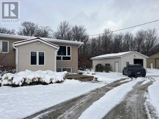home & garage - 587317 9Th Side Road, Blue Mountains, ON - Outdoor With Facade