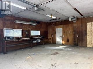 Large Heated Garage with Bench - 587317 9Th Side Road, Blue Mountains, ON - Indoor Photo Showing Garage