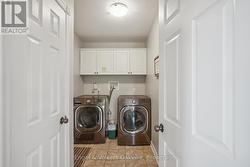 Main Floor Laundry, W/O to garage -