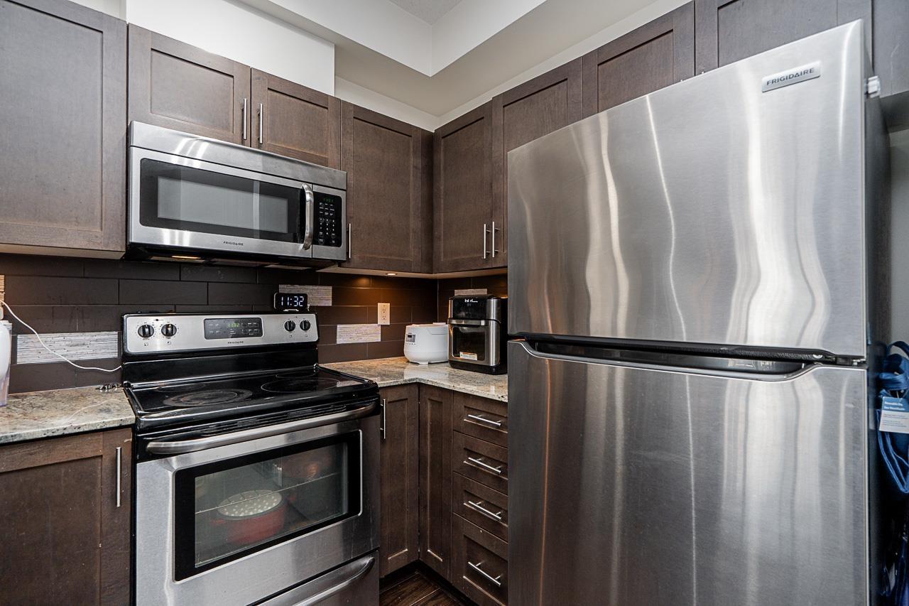 215 13468 King George Boulevard, Surrey, BC - Indoor Photo Showing Kitchen With Stainless Steel Kitchen