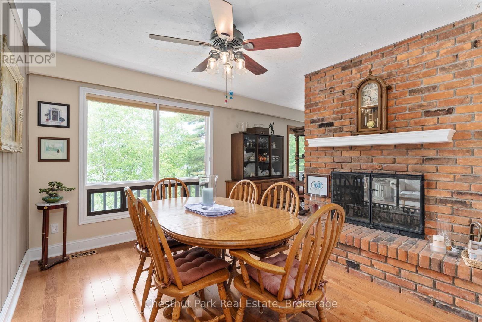 652 North Waseosa Lake Road, Huntsville (Chaffey), ON - Indoor Photo Showing Dining Room With Fireplace