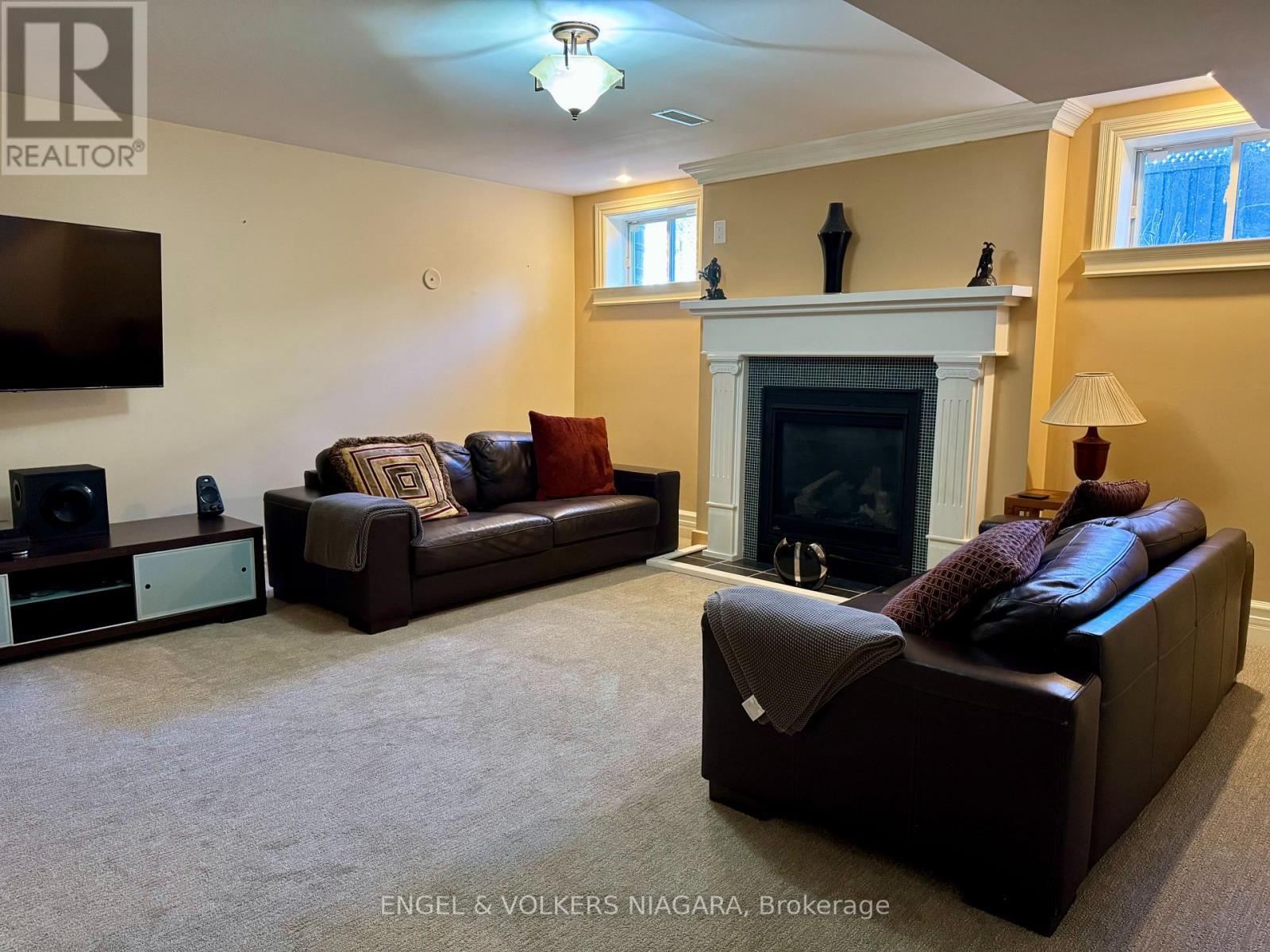 BAsement recroom - 14650 Niagara Parkway, Niagara-On-The-Lake (Queenston), ON - Indoor Photo Showing Living Room With Fireplace