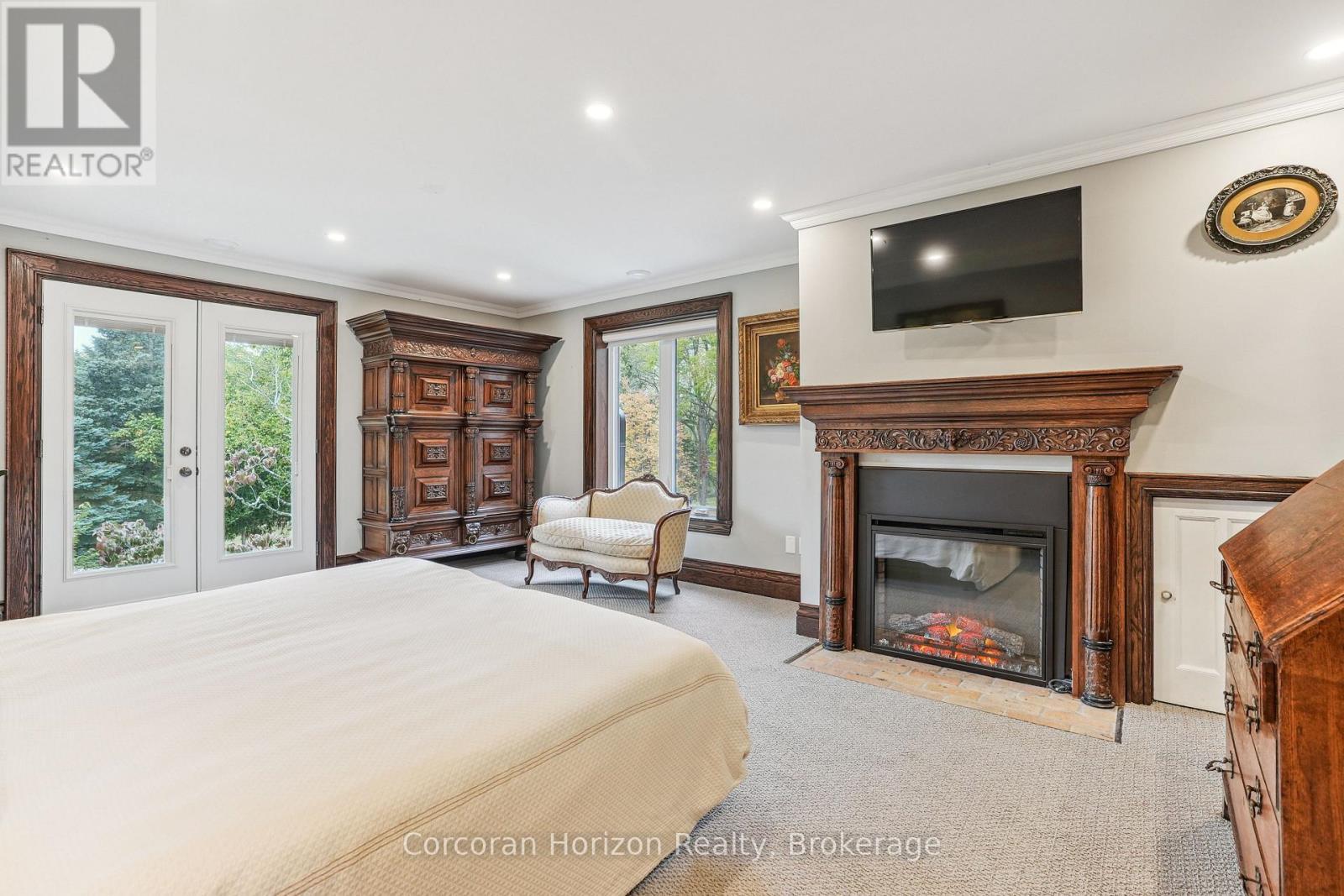 353 Sulphur Springs Road, Hamilton (Ancaster), ON - Indoor Photo Showing Bedroom With Fireplace