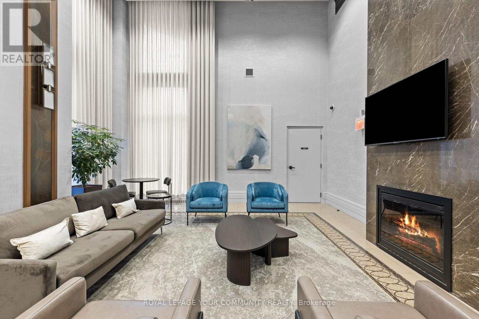 515 - 385 Prince Of Wales Drive, Mississauga, ON - Indoor Photo Showing Living Room With Fireplace