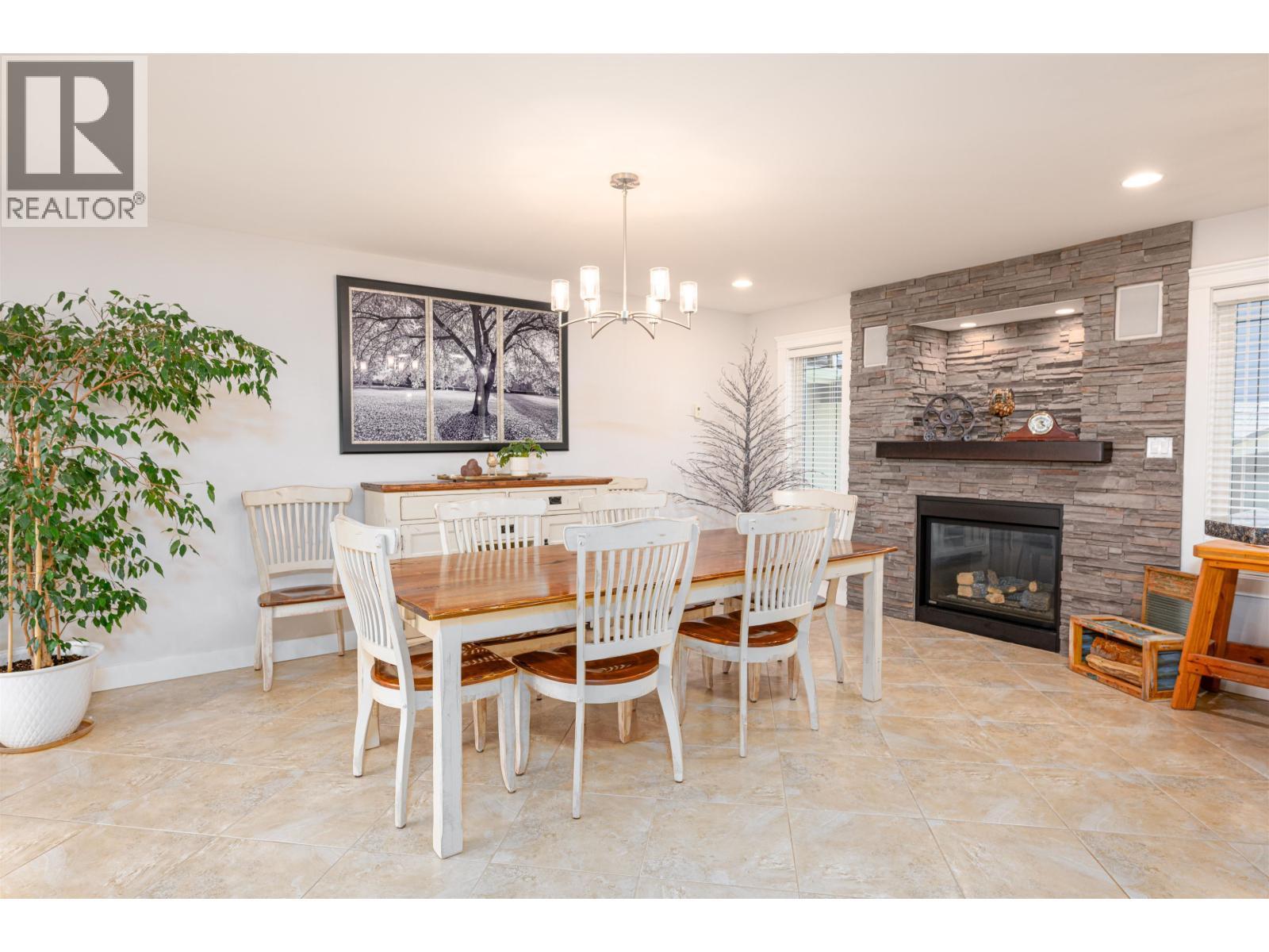 6981 Westmount Drive, Prince George, BC - Indoor Photo Showing Dining Room With Fireplace