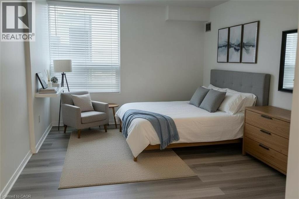 Bedroom featuring light wood finished floors and baseboards - 389 Dundas Street Unit# 1506, London, ON - Indoor Photo Showing Bedroom