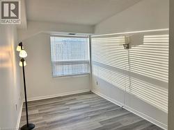 Spare room with light wood-style floors and a textured ceiling -