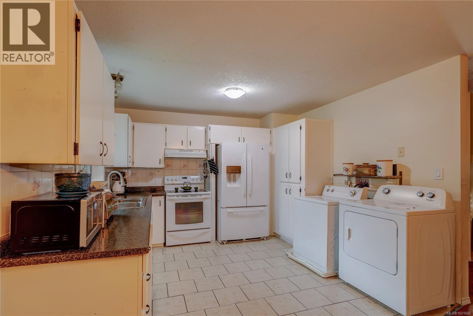 Upper Kitchen and Laundry Area - 118 Chantrells Pl, Nanaimo, BC - Indoor Photo Showing Laundry Room
