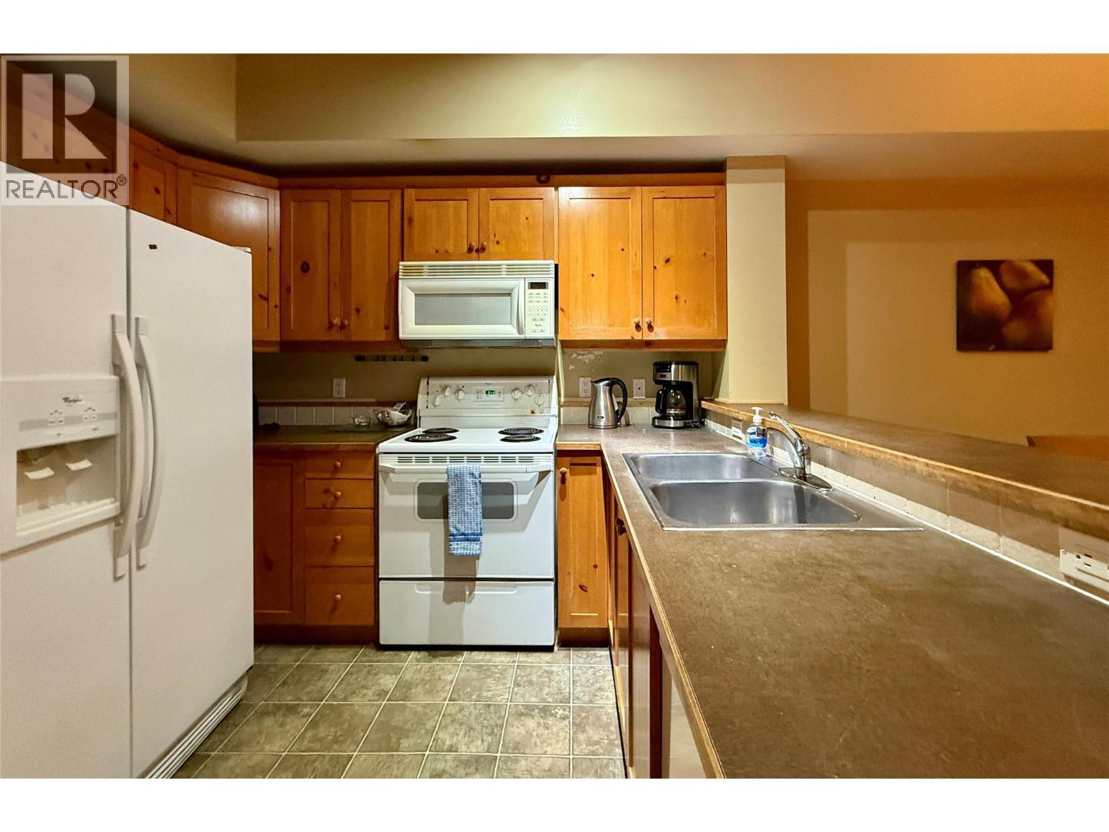 300 Stemwinder Drive Unit# 210, Kimberley, BC - Indoor Photo Showing Kitchen With Double Sink