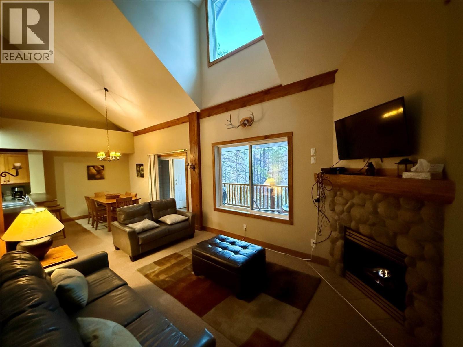 300 Stemwinder Drive Unit# 210, Kimberley, BC - Indoor Photo Showing Living Room With Fireplace