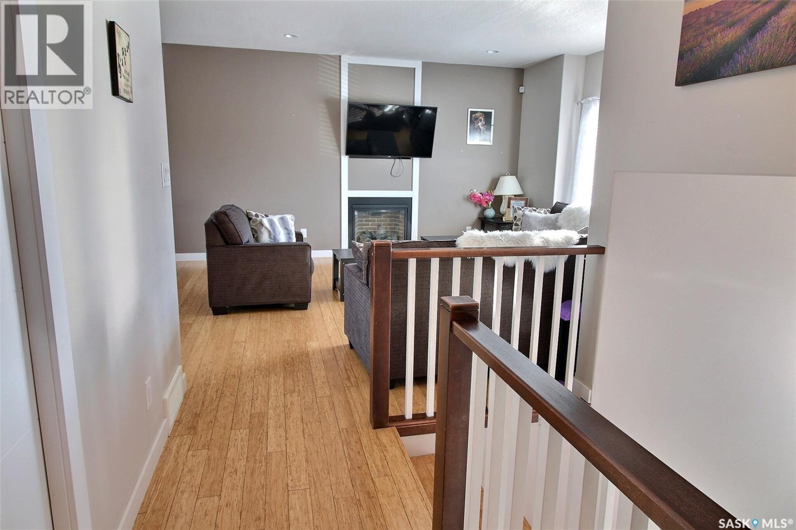 857 Madsen Place, Prince Albert, SK - Indoor Photo Showing Other Room With Fireplace