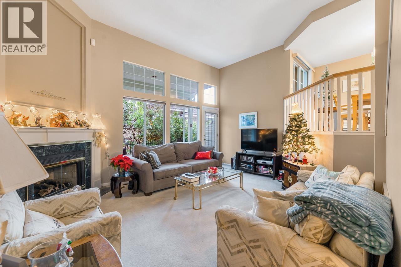 233 Waterleigh Drive, Vancouver, BC - Indoor Photo Showing Living Room With Fireplace