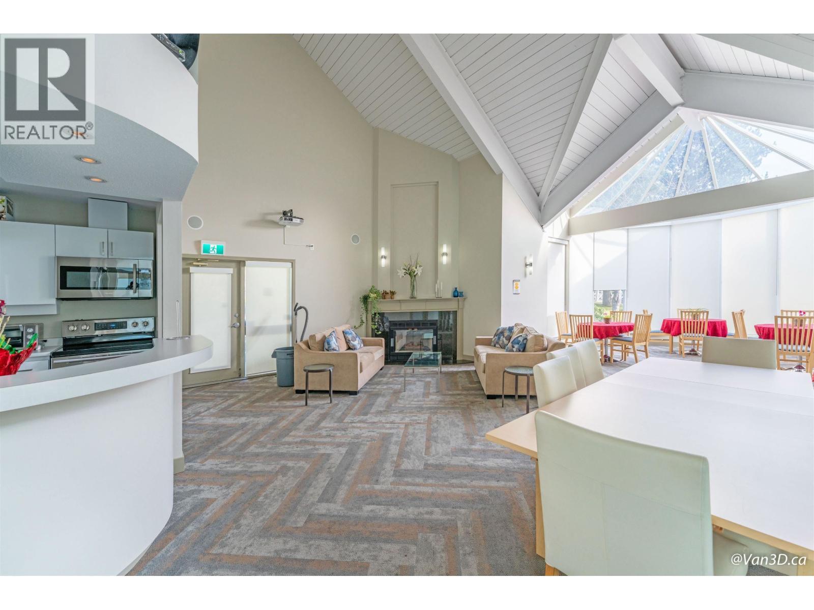 233 Waterleigh Drive, Vancouver, BC - Indoor Photo Showing Kitchen With Fireplace