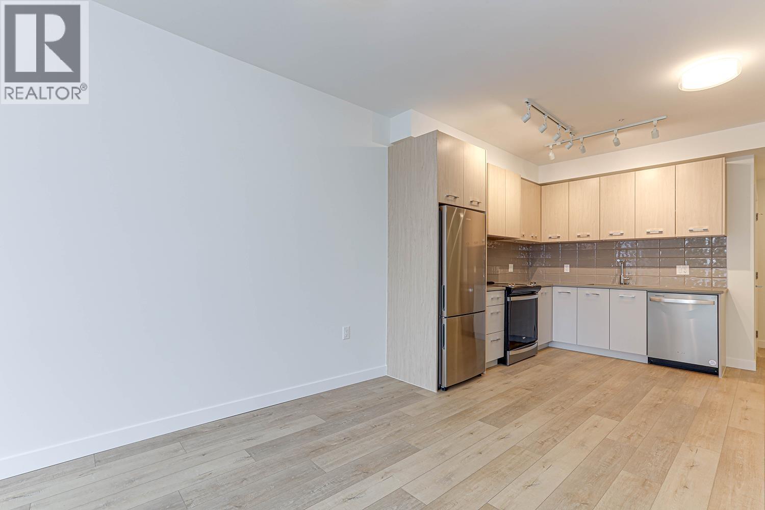 411 4933 Clarendon Street, Vancouver, BC - Indoor Photo Showing Kitchen With Stainless Steel Kitchen