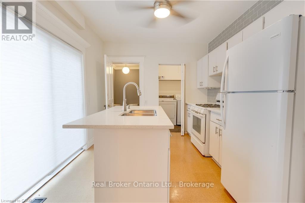 Kitchen with access to deck - 808 Monmouth Road, Essex, ON - Indoor Photo Showing Kitchen With Double Sink