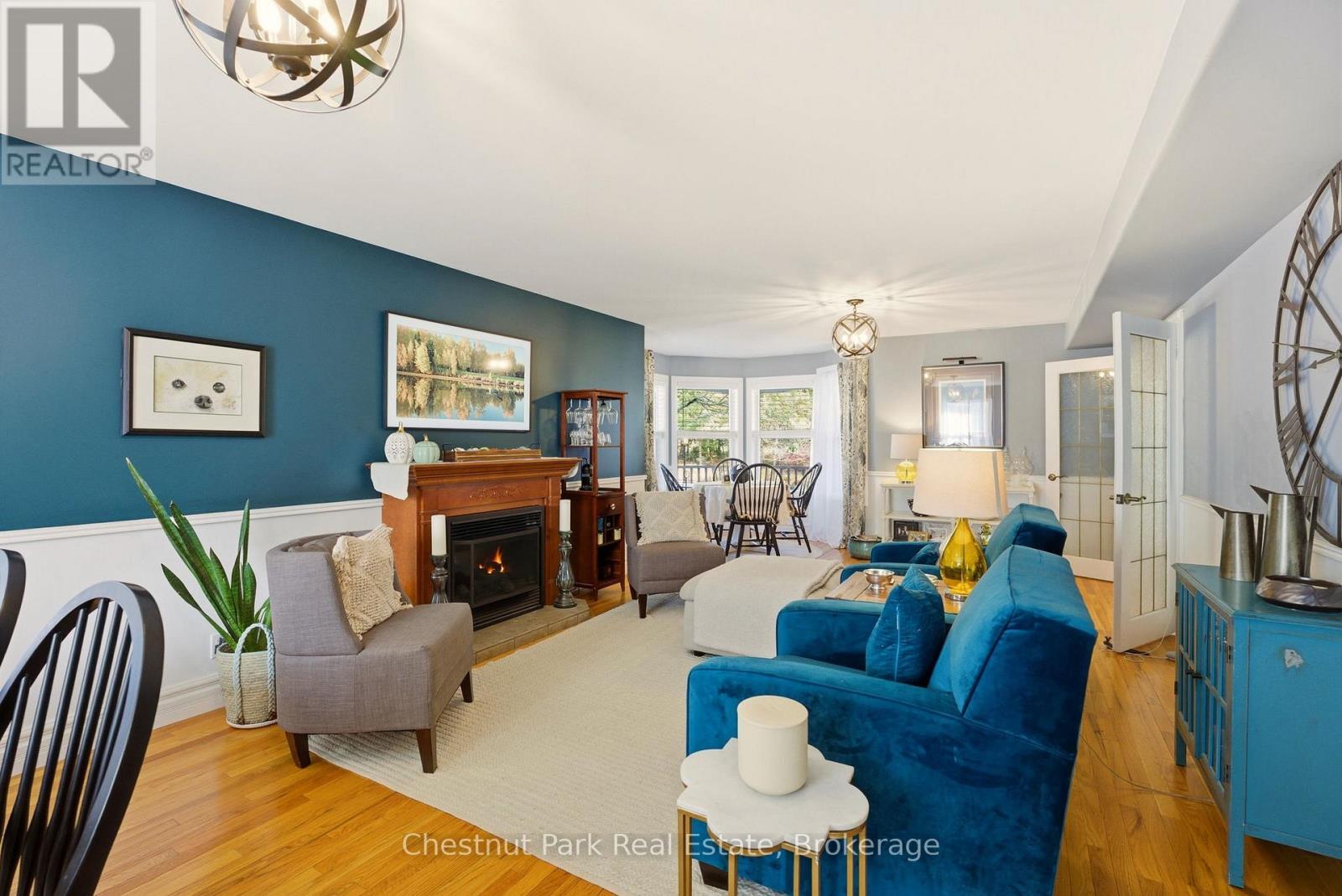 75 Pond Crescent, Huntsville (Chaffey), ON - Indoor Photo Showing Living Room With Fireplace