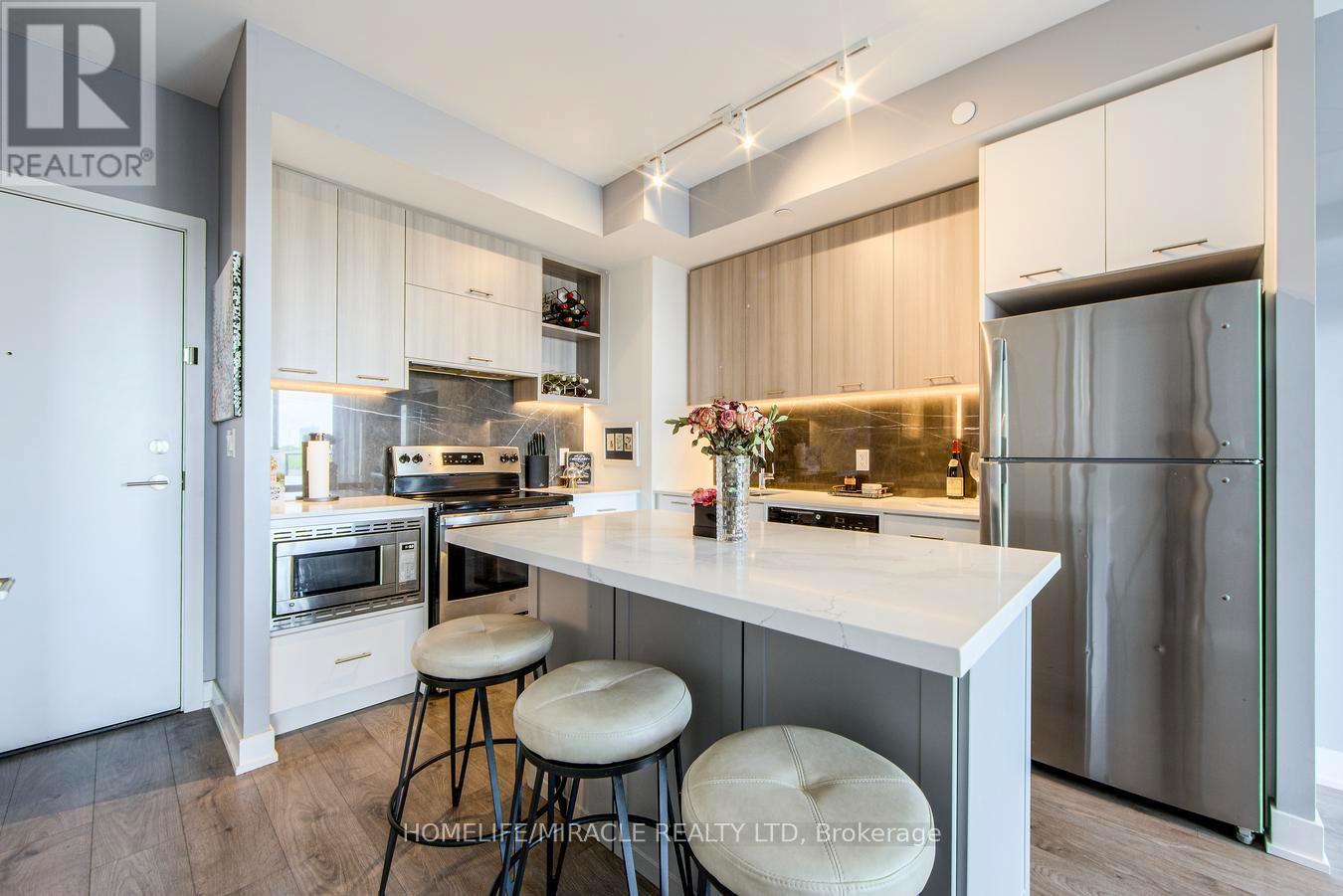 703 - 180 Veterans Drive, Brampton, ON - Indoor Photo Showing Kitchen With Stainless Steel Kitchen With Upgraded Kitchen