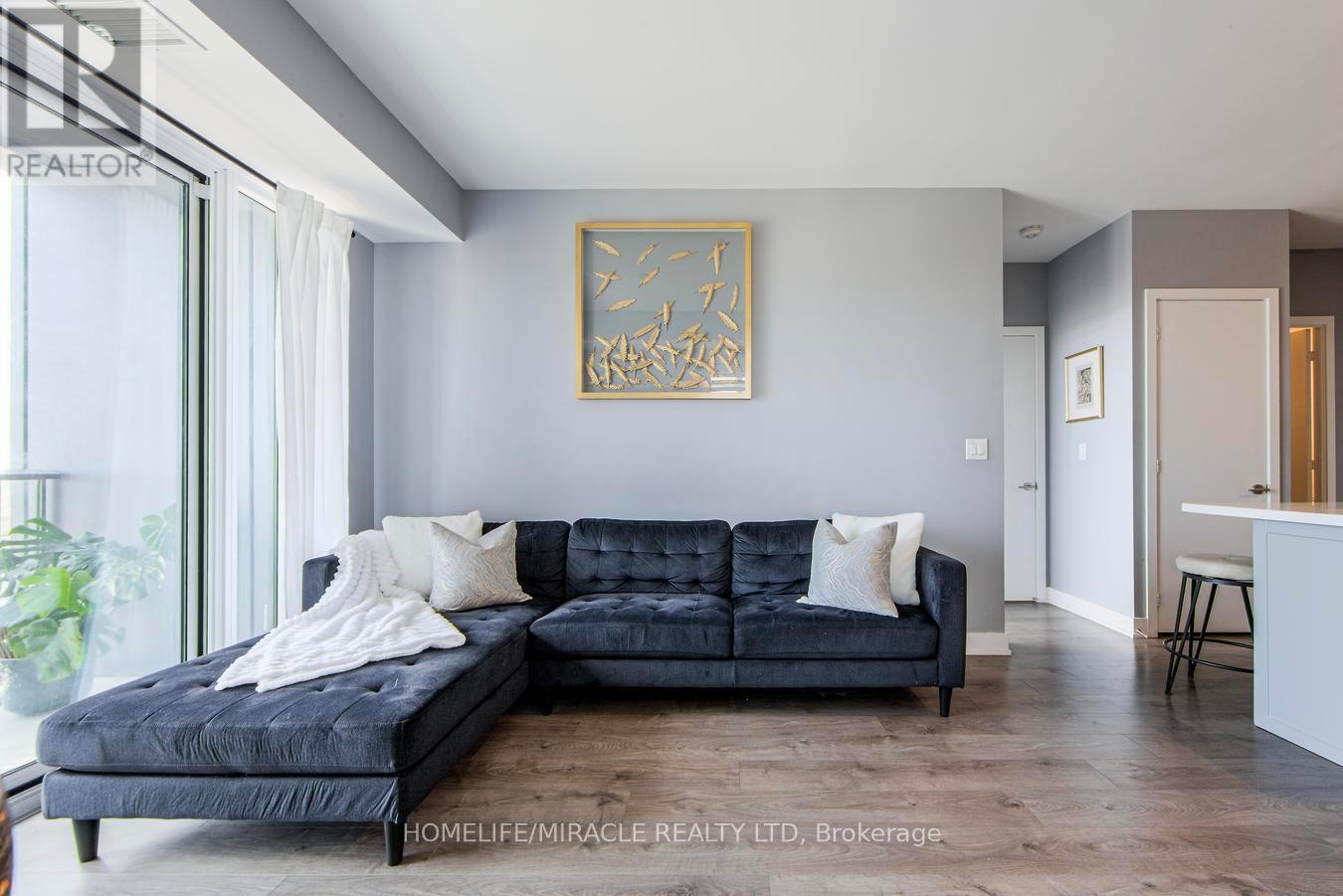 703 - 180 Veterans Drive, Brampton, ON - Indoor Photo Showing Living Room