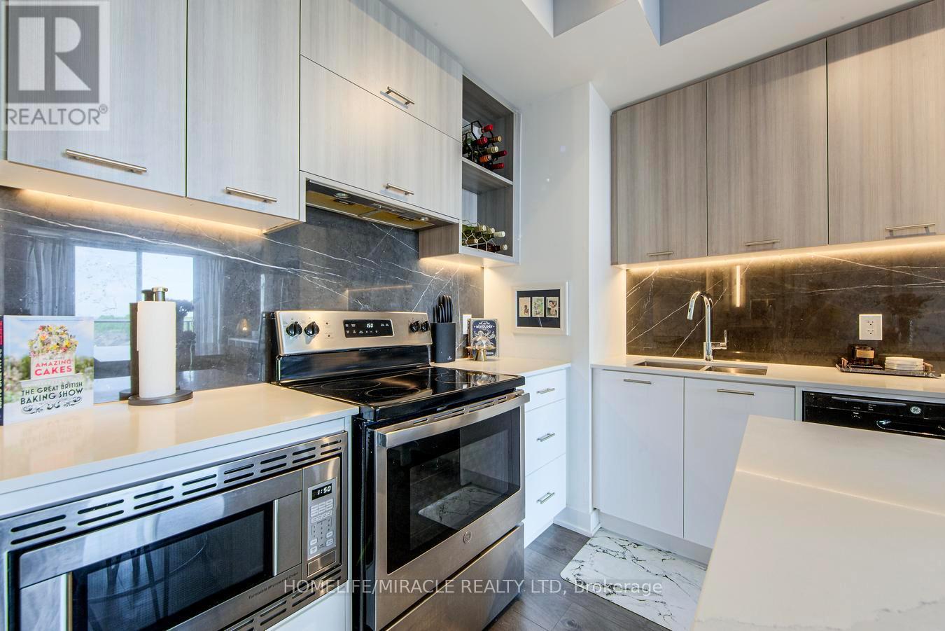 703 - 180 Veterans Drive, Brampton, ON - Indoor Photo Showing Kitchen With Stainless Steel Kitchen With Double Sink With Upgraded Kitchen