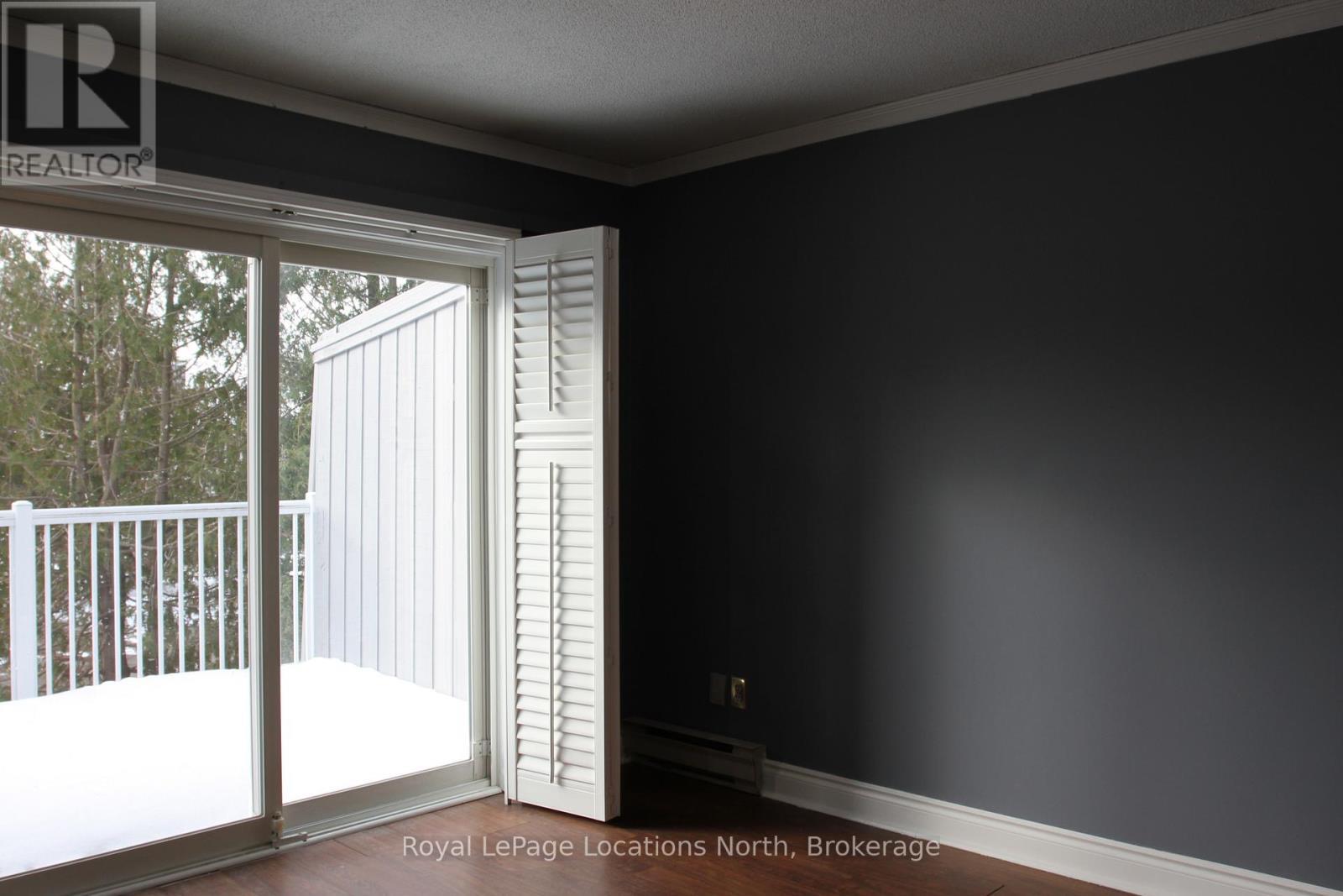 Primary Bedroom with walkout to the deck - 61 - 19 Dawson Drive, Collingwood, ON - Indoor Photo Showing Other Room