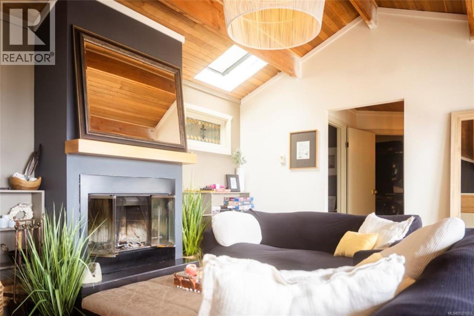 6641 Island Hwy W, Bowser, BC - Indoor Photo Showing Living Room With Fireplace