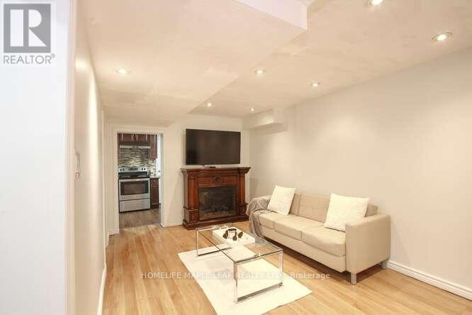 7-13 - 13 Lotherton Pathway, Toronto, ON - Indoor Photo Showing Living Room With Fireplace