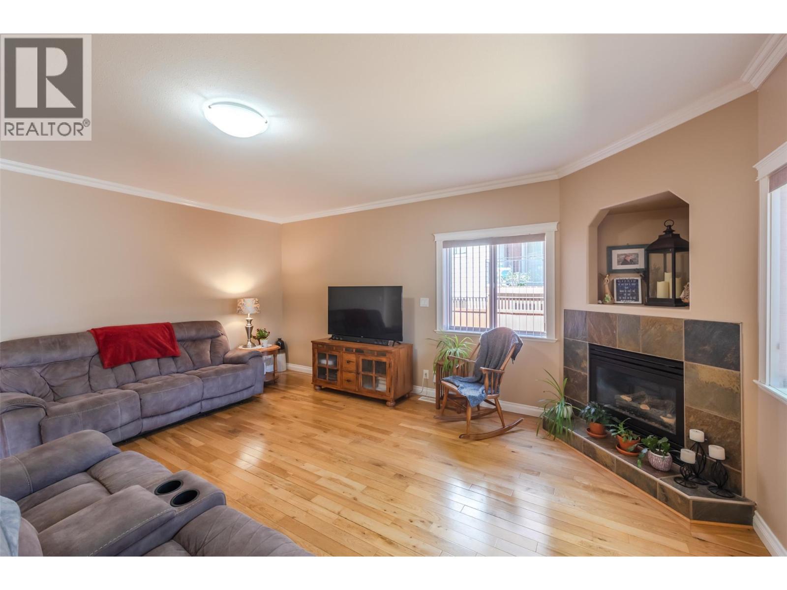 144 Power Street Unit# 103, Penticton, BC - Indoor Photo Showing Living Room With Fireplace