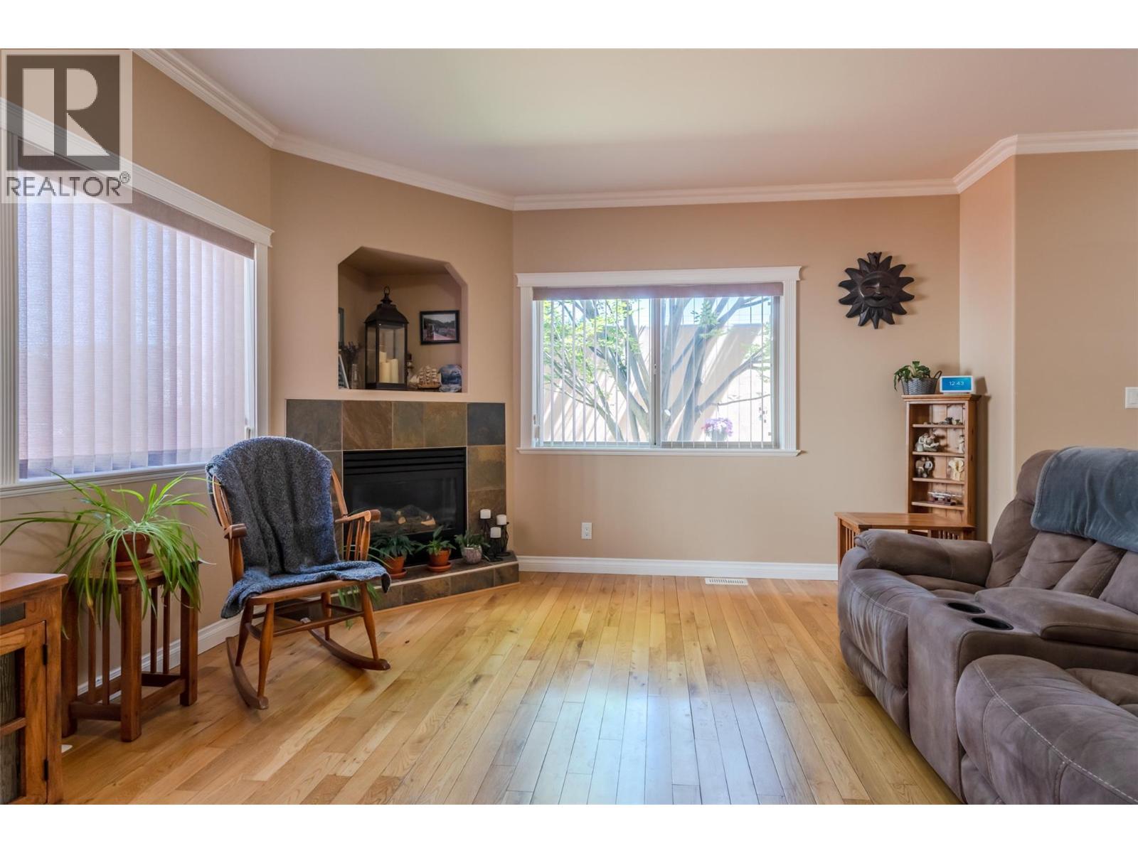 144 Power Street Unit# 103, Penticton, BC - Indoor Photo Showing Living Room With Fireplace