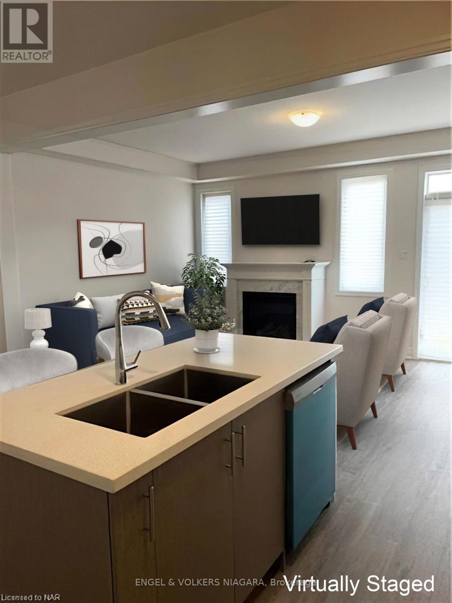 9248 Griffon Street, Niagara Falls (Lyons Creek), ON - Indoor Photo Showing Kitchen With Fireplace With Double Sink