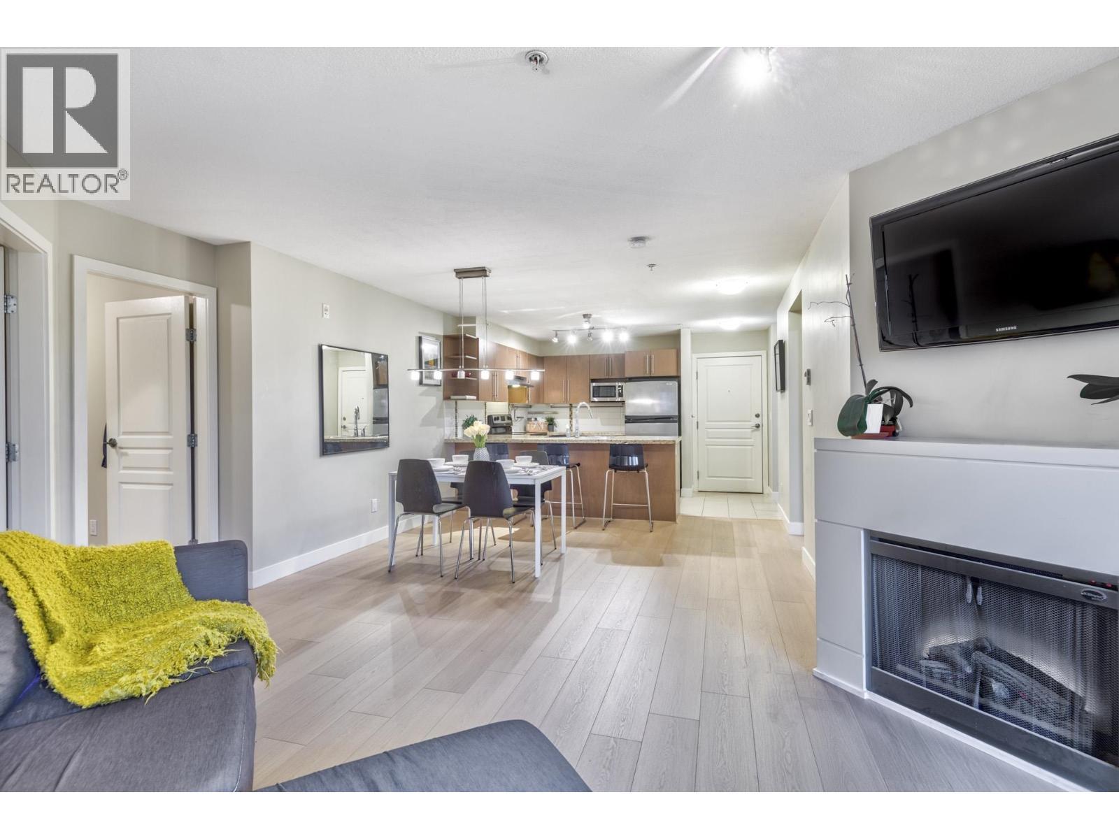 209 2088 Beta Avenue, Burnaby, BC - Indoor Photo Showing Living Room With Fireplace